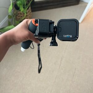 GoPro Black Camera with Orange Handle